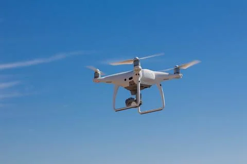 Quadrocopter flying in the sky Stock Photos