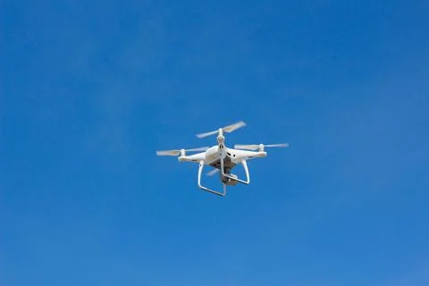 Quadrocopter flying in the sky Stock Photos