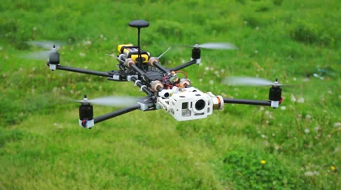 Quadrocopter on a green meadow. View around Stock Footage 38298625
