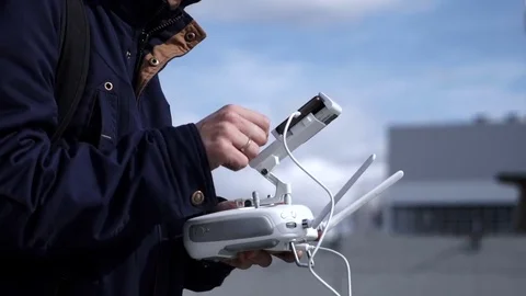 Quadrocopter in the hands of a man close-up Видео 75495977