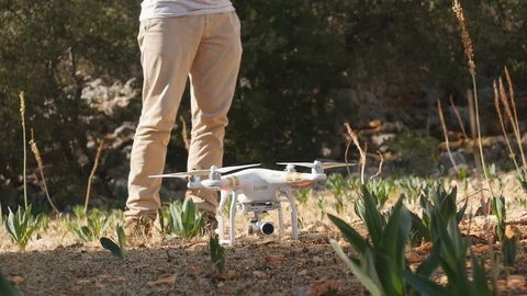 Quadrocopter with mounted camera flying in sky, filming video, modern technology Stock Footage 104088103