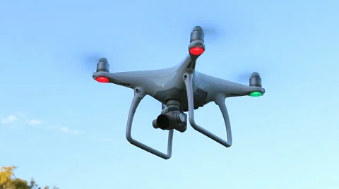 Quadrocopter Phantom 4 drone flies over blue sky. Stock Footage 67512448