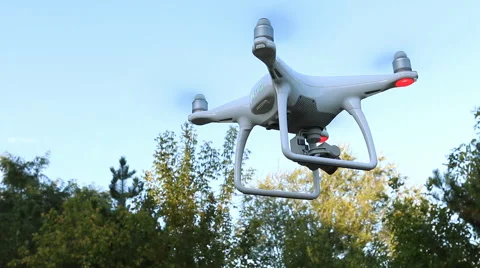 Quadrocopter Phantom 4 drone flies over blue sky. Stock Footage 67512535