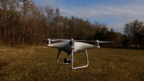 Quadrocopter Phantom 4 drone flies over blue sky. Stock Footage 69123521