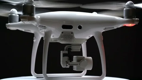 Quadrocopter rotates on the turntable Stock Footage 84314132