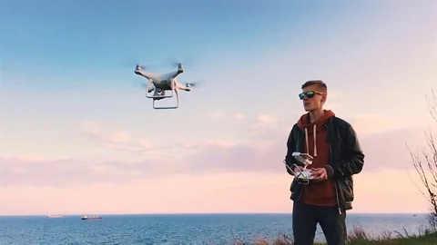 Quadrocopter takes off from the pilot's hand in slow motion. Running the Dron. Stock Footage 74797337