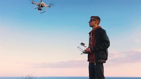 Quadrocopter takes off from the pilot's hand in slow motion. Running the Dron. Stock Footage 74797580