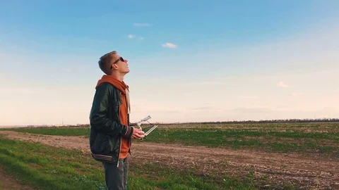 Quadrocopter takes off from the pilot's hand in slow motion. Running the Dron. Stock Footage 74797946