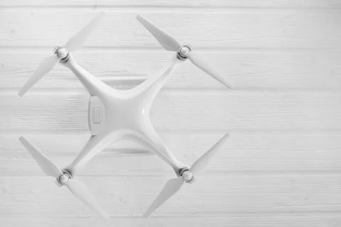 Quadrocopter on a white wooden background Foto stock
