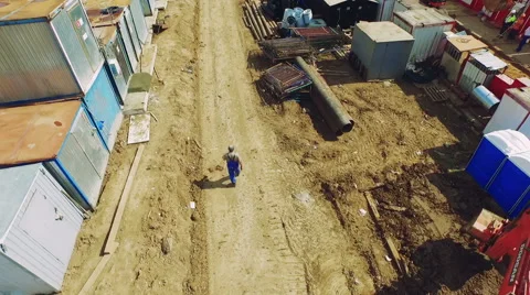 Quadrocopters Flying Over the Construction Site and Construction Materials Stock Footage 60774643