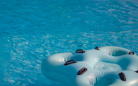 Quadruple rubber ring for riding on the water slides, swim in the pool at the Stock Photos