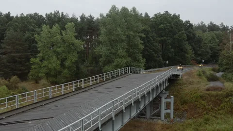 Quads driving over the bridge. Stock Footage 297564387
