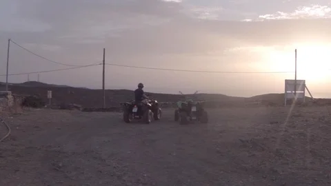 Quads under sunset 60fps Stock Footage 128043501