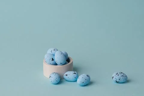 Quail blue easter eggs on blue background. Minimal comcept with copy space Stockfoto's
