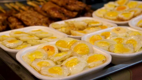 Quail Egg Skewers being cooked at Shilin Night Market, Taipei, Taiwan. Taiwanese Stock Footage 313533093