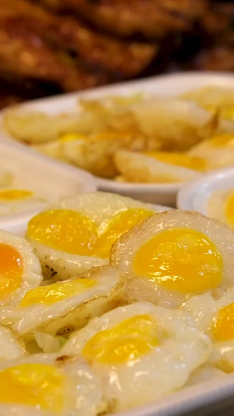 Quail Egg Skewers being cooked at Shilin Night Market, Taipei, Taiwan. Taiwanese Stock Footage 313809591