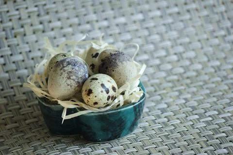 Quail eggs. Background is decorative. Stock Photos