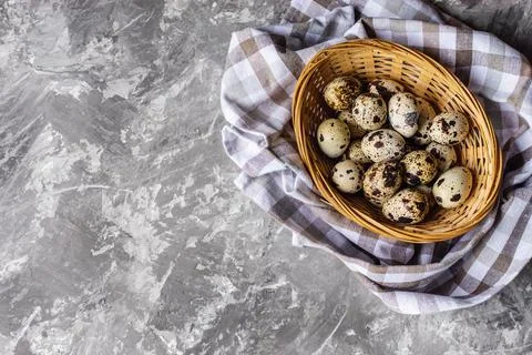Quail eggs in a basket in the kitchen Stock Photos