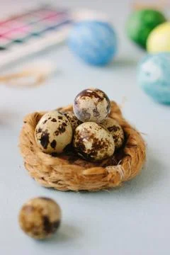 Quail eggs over bright background for easter celebration. Stock Photos