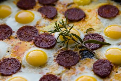 Quail eggs in pan Stock Photos