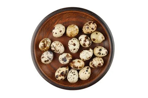 Quail eggs on a plate isolate. Stock Photos