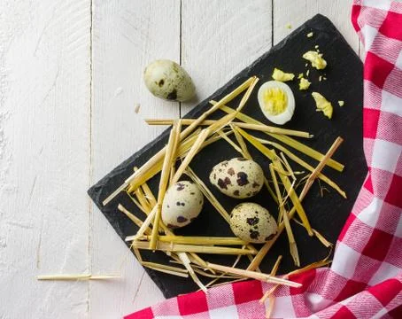 Quail eggs on the table. Spotted shell. Vitamin breakfast Stock Photos