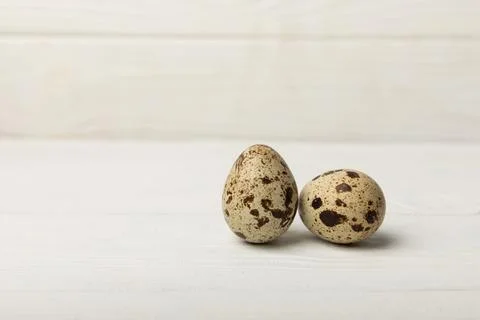 Quail eggs on  texture background Stock Photos