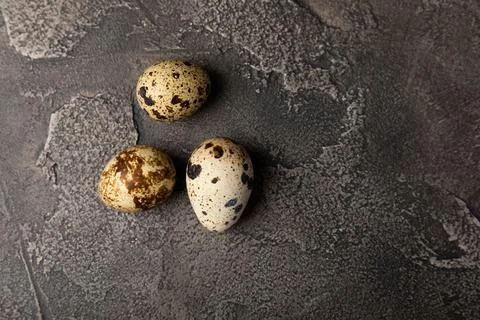 Quail eggs on  texture background. Stock Photos