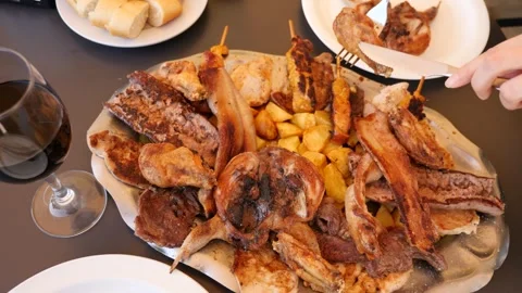 Quails cooked on the grill and served on a large plate, against the background Stock Footage 341381413