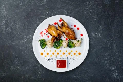 Quails meat on the grill. Stock Photos