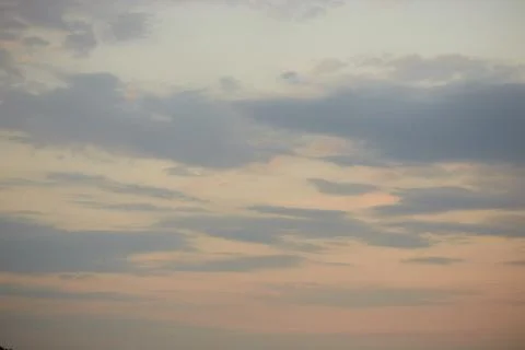 Quaint clouds in the sky before sunset. Stock Photos