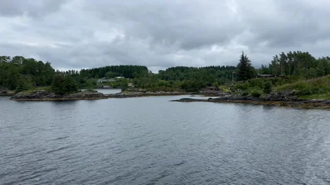A quaint cottage situated by the water's edge Stock Footage 314097901