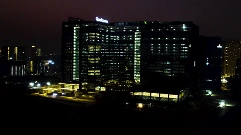 Qualcomm office building push in drone shot night 4k 30p Stock Footage 232256207