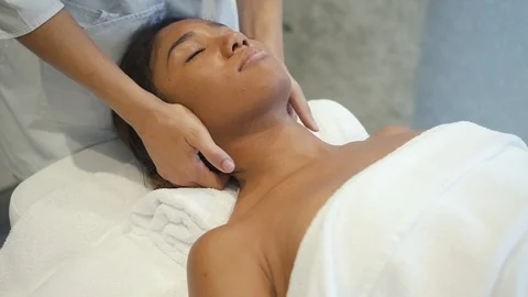 Qualified massage master making neck lifting in spa salon Видео 111030678