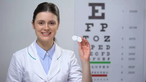 Qualified optometrist recommending new contact lenses, new methods, improvement Stock Footage
