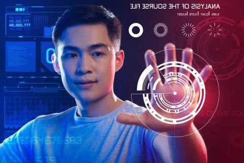 Qualified web developer looking at the image on the screen while working Stock Photos