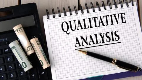 QUALITATIVE ANALYSIS - words in a notebook on the background of a calculator  Stock Photos