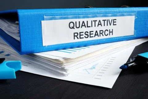 Qualitative research methods report in a blue folder. Stock Photos