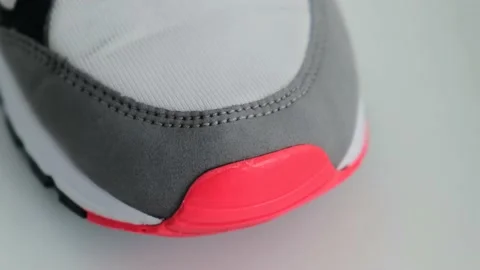 Qualitative stitching with a thread of a men's sneaker, close-up Video stock 194702758