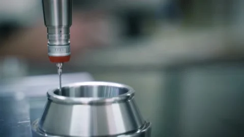 A Quality Check Specialist controlling the CMM Probe to Analyze a Stock Footage 165437457