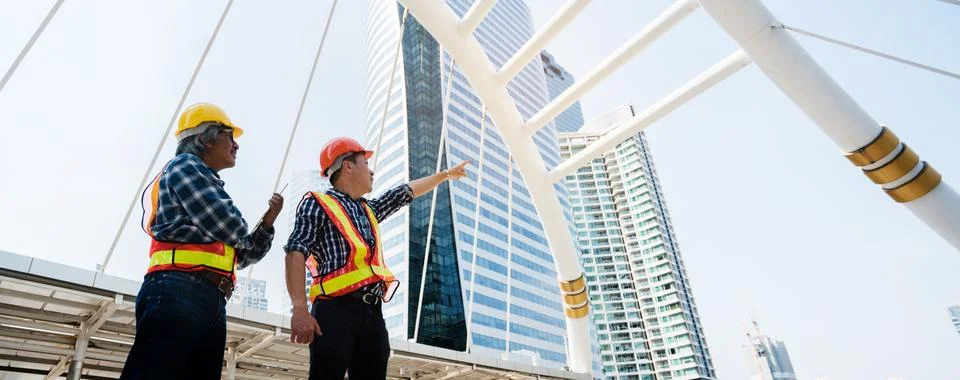 Quality construction teamwork. Safety concern Stockfoto's
