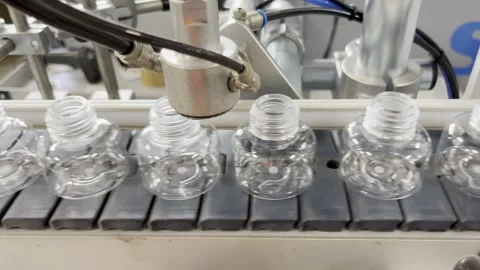 Quality control of bottles. Pet material. Small bottle, cosmetics. Stock Footage 265787779