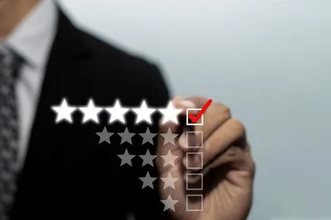 Quality control. businessman hand checking mark five star rating on checklist Stock Photos