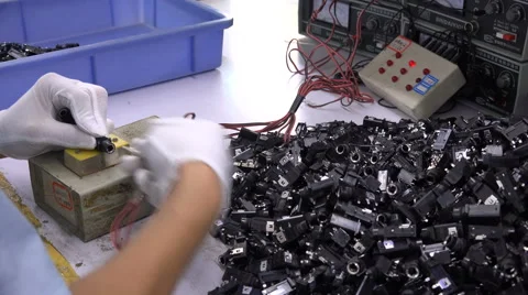 Quality control in a Chinese electronics factory, closeup of hands and gloves Stock Footage 67549134