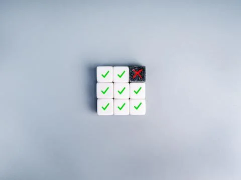 Quality control concept with checklist blocks showing pass and fail status .. 写真素材