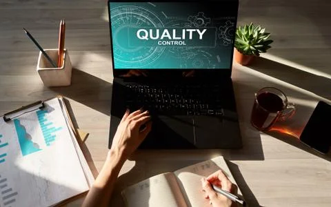 Quality control concept on device screen. Business and technology concept. Stock Photos