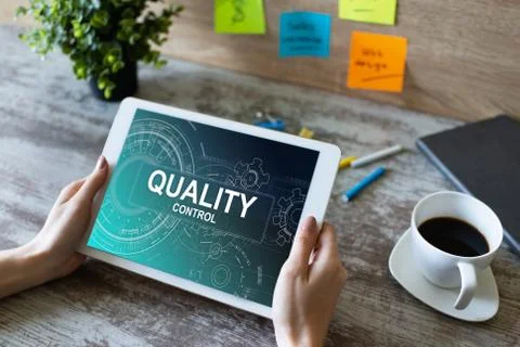 Quality control concept on device screen. Business and technology concept. Stock-Fotos