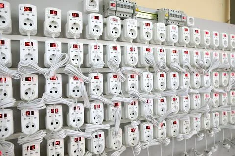 Quality control of electronic devices at the stand. Manufacture of sockets vo Stock Photos