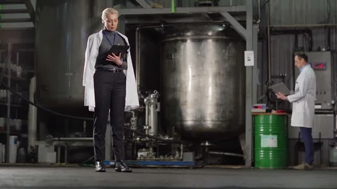 Quality control expert making notes in report Stock Footage 127709670