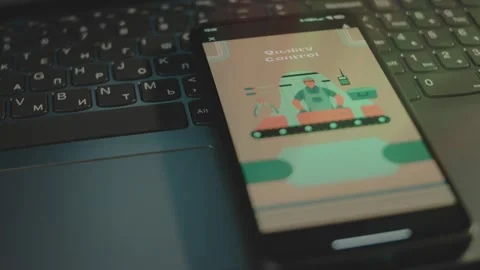 Quality Control inscription on smartphone screen. Graphic presentation of Stock Footage 270939014